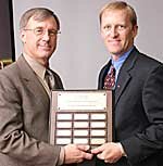 Kristofer Hagglund, PhD, right, receives the UAB Psychology Distinguished Alumni Award
