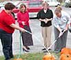 MOPEDS staff members scrubbing pumpkins getting ready for a family event