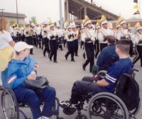 photo of spinal cord injury patients enjoying Marching Mizzou