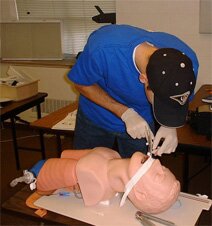 Scott practicing intubation